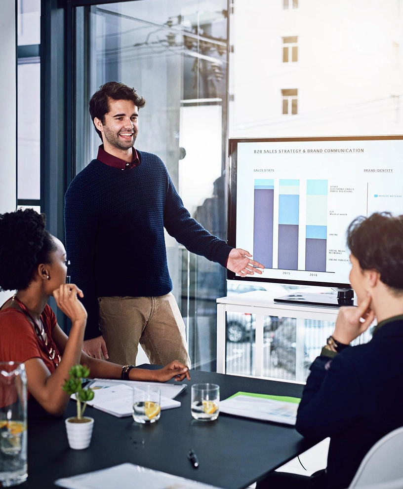 Business team reviewing HubSpot analytics dashboard during strategy meeting